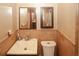 Bathroom with a modern vanity, mirror, and updated sink hardware at 125 Pebble Beach Ct, Atlanta, GA 30349