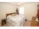 Bedroom featuring carpet, a twin bed, closet storage, and a wooden desk at 125 Pebble Beach Ct, Atlanta, GA 30349