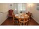 Dining room featuring wood table and chairs with an area rug at 125 Pebble Beach Ct, Atlanta, GA 30349