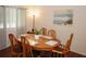 Dining room featuring wood table and chairs with an area rug at 125 Pebble Beach Ct, Atlanta, GA 30349