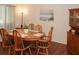 Dining room featuring wood table and chairs with an area rug and wall art at 125 Pebble Beach Ct, Atlanta, GA 30349