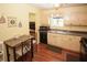 Traditional kitchen featuring black appliances, breakfast table, and light wood cabinetry at 125 Pebble Beach Ct, Atlanta, GA 30349
