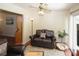 Comfortable living room featuring hardwood floors, neutral colors, and plenty of natural light at 125 Pebble Beach Ct, Atlanta, GA 30349
