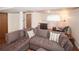 Spacious living room features a comfortable sectional sofa, ideal for entertaining guests at 125 Pebble Beach Ct, Atlanta, GA 30349