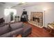 Inviting living room boasts a stone fireplace and comfortable seating arrangement at 125 Pebble Beach Ct, Atlanta, GA 30349