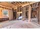 Interior view with exposed wooden framing and subfloor ready for customization and renovation at 1406 Allene Sw Ave, Atlanta, GA 30310