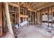 View of an unfinished interior space featuring exposed wood framing, offering a glimpse into the renovation process at 1406 Allene Sw Ave, Atlanta, GA 30310