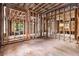 The room is under construction with exposed wood framing, showcasing a design ready for customization with potential for creating a modern layout at 1406 Allene Sw Ave, Atlanta, GA 30310