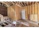 Under-construction interior showing a staircase and exposed wood framing, providing a canvas for designing a modern layout with custom finishes at 1406 Allene Sw Ave, Atlanta, GA 30310