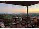 Breathtaking sunset view from a private balcony with comfortable seating at 413 Horizon Trl, Canton, GA 30114