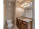 Bathroom featuring a vanity with a large mirror and a toilet at 6186 Talmadge Nw Run, Acworth, GA 30101
