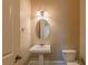 Powder room featuring a pedestal sink, an oval mirror and accent lighting at 6186 Talmadge Nw Run, Acworth, GA 30101