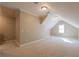 Upstairs bedroom featuring a bright window and dormers, carpeted and freshly painted at 6186 Talmadge Nw Run, Acworth, GA 30101