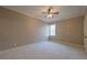 Spacious bedroom features neutral paint, plush carpet, ceiling fan and a bright window at 6186 Talmadge Nw Run, Acworth, GA 30101