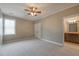 Bedroom features neutral paint, carpet, ceiling fan and access to an en-suite bathroom at 6186 Talmadge Nw Run, Acworth, GA 30101