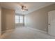 Spacious bedroom featuring a ceiling fan, neutral paint, and natural light from the window at 6186 Talmadge Nw Run, Acworth, GA 30101