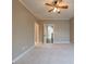 Spacious bedroom featuring a ceiling fan, neutral paint and easy access to the hallway at 6186 Talmadge Nw Run, Acworth, GA 30101