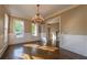 Formal dining room with large windows, wainscoting detail and a chandelier at 6186 Talmadge Nw Run, Acworth, GA 30101