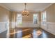 Traditional dining room with hardwood floors, crown molding, and elegant chandelier at 6186 Talmadge Nw Run, Acworth, GA 30101