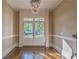 Elegant entryway showcasing double doors, hardwood floors, and a view of the landscaped front yard at 6186 Talmadge Nw Run, Acworth, GA 30101