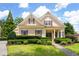 Charming single-Gathering home with lush landscaping and blue skies at 6186 Talmadge Nw Run, Acworth, GA 30101