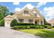 Charming home featuring a well-manicured lawn and lovely, trimmed greenery and sidewalk to the front door at 6186 Talmadge Nw Run, Acworth, GA 30101