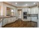 Gourmet kitchen with stainless steel appliances, dark granite countertops, and hardwood floors at 6186 Talmadge Nw Run, Acworth, GA 30101