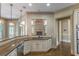 Gourmet kitchen featuring granite countertops, stainless steel appliances, and a central island with bar seating at 6186 Talmadge Nw Run, Acworth, GA 30101