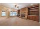 Spacious living room featuring a stone fireplace, built-in shelving and recessed lighting at 6186 Talmadge Nw Run, Acworth, GA 30101