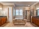 Main bathroom has a tub with steps, glass enclosed shower, and granite countertops at 6186 Talmadge Nw Run, Acworth, GA 30101