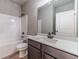 Modern bathroom with a gray vanity, quartz countertop, and shower-tub combination at 1500 Alcovy Station Rd, Covington, GA 30014
