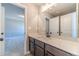 Bathroom vanity with a large mirror and cabinets offering ample storage space at 1500 Alcovy Station Rd, Covington, GA 30014