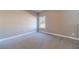 Cozy bedroom featuring neutral paint, a window, and plush carpeting at 1500 Alcovy Station Rd, Covington, GA 30014