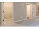 Bedroom featuring carpet flooring, a walk-in closet with wire shelving, and neutral colored walls at 1500 Alcovy Station Rd, Covington, GA 30014