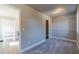 Bedroom with walk-in closet, view into the bathroom, and neutral paint at 1500 Alcovy Station Rd, Covington, GA 30014