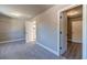 Bedroom with walk-in closet and view into the Primary bath and hallway at 1500 Alcovy Station Rd, Covington, GA 30014
