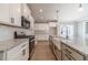 Well-appointed kitchen featuring granite countertops, stainless steel appliances, and stylish modern finishes at 1500 Alcovy Station Rd, Covington, GA 30014