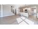 Open-concept kitchen featuring white cabinets, a center island, and stainless-steel appliances at 1500 Alcovy Station Rd, Covington, GA 30014