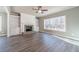 Bright living room featuring a fireplace, built-in shelving, and large windows at 1500 Alcovy Station Rd, Covington, GA 30014