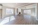 Spacious living room with fireplace, built-ins, large windows, and beautiful flooring at 1500 Alcovy Station Rd, Covington, GA 30014