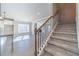 Staircase view showcasing natural light and connections to the living and kitchen areas at 1500 Alcovy Station Rd, Covington, GA 30014
