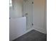 Modern bathroom featuring a sleek glass shower with contemporary gray tile flooring at 1670 Knob Creek Nw Ct, Acworth, GA 30101