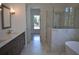 Luxurious bathroom featuring double vanity, marble floors, soaking tub, and glass-enclosed shower at 1670 Knob Creek Nw Ct, Acworth, GA 30101