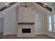 Beautiful brick fireplace with wood mantle, vaulted ceiling, and hardwood floors at 1670 Knob Creek Nw Ct, Acworth, GA 30101
