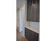 Hallway featuring grey cabinetry with gold hardware at 1670 Knob Creek Nw Ct, Acworth, GA 30101