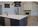 Open concept living room with hardwood floors, fireplace, and kitchen island at 1670 Knob Creek Nw Ct, Acworth, GA 30101