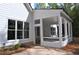 Screened-in porch with exposed rafters offers a relaxing outdoor living space at 1670 Knob Creek Nw Ct, Acworth, GA 30101