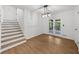 Dining room features a staircase and french doors leading to the backyard at 1690 Eaglecreek Trl, Cumming, GA 30041