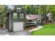 View of exterior featuring front lawn and attached garage at 1690 Eaglecreek Trl, Cumming, GA 30041
