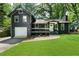 Charming home with a well-manicured lawn, attached garage and a cozy front porch at 1690 Eaglecreek Trl, Cumming, GA 30041